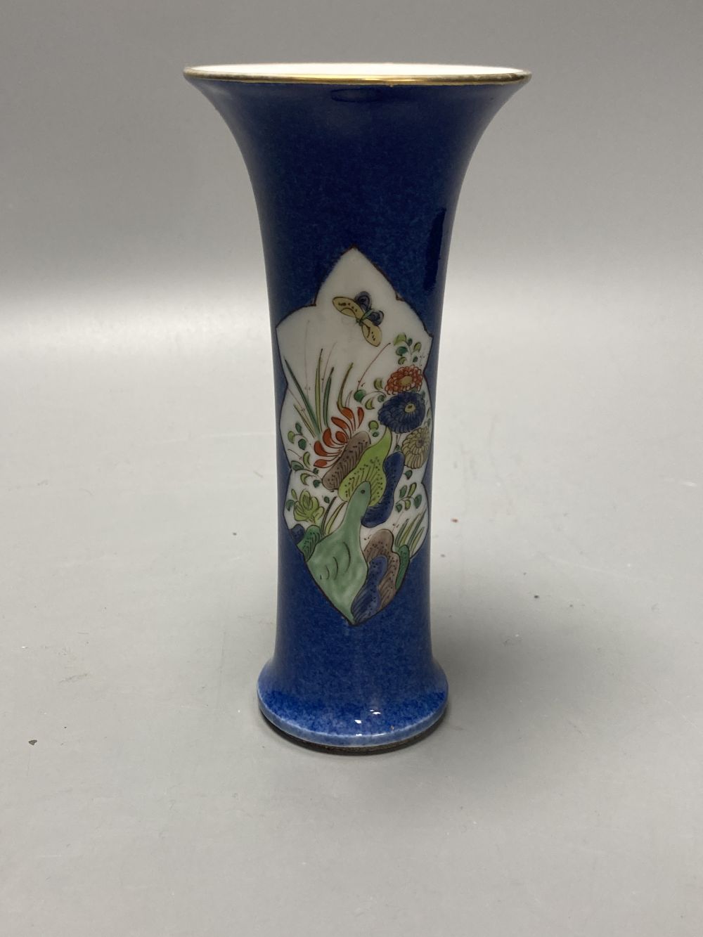 A Chinese powder blue ground vase and a similar cloisonne bottle vase, height 15cm